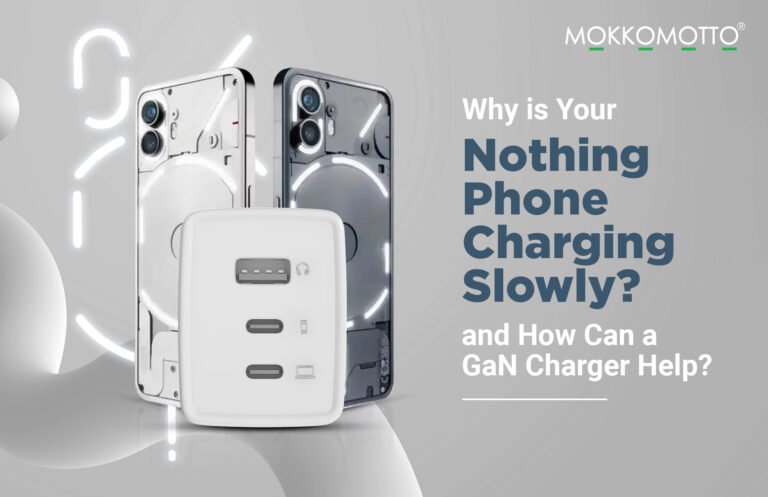 Promotional graphic showing two Nothing phones with illuminated LED glyphs beside a white multi-port GaN wall charger (USB‑A and two USB‑C). Headline text reads: “Why is your Nothing Phone charging slowly? and how can a GaN charger help?” with the MOKKOMOTTO logo on a gray background.